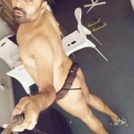 Indian Gay Porn: Sexy NRI hunk exposing his hot body in a skimpy thong and heels