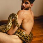 Nude Indian Hunk Posing with a Giant Python