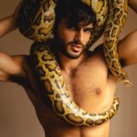 Nude Indian Hunk Posing with a Giant Python