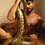 Nude Indian Hunk Posing with a Giant Python