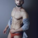 Sexy Naked Hunk Posing in Briefs for Ad