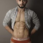 Sexy Naked Hunk Posing in Briefs for Ad