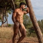 Outdoor gay pics of sexy hunk's nude photoshoot