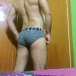 Horny naked hunk posing in sexy briefs