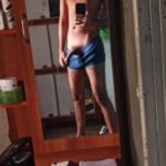 Young naked boy in briefs teasing big bulge