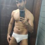 Muscular Indian hunk shows fit body in white briefs