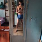 Young naked boy in briefs teasing big bulge