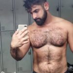 Hairy muscle hunk shows sexy body in bulging briefs