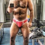 Hairy muscle hunk shows sexy body in bulging briefs