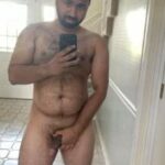 Stripping gay bear teasing hot body and cock