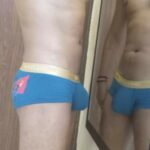 Muscular underwear hunk teasing body in briefs