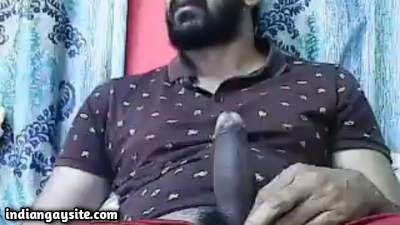 Bearded horny man jerking off his big thick cock