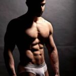 Muscular hot stud teasing sexy abs and bulge