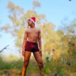 Naked gay santa teasing his hot body outdoors