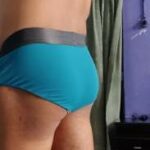 Big butt boy stripping out of his tight briefs in pics