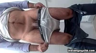 Stripping hot guy teasing his big dick in undies