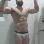 Muscular horny hunk teasing his sexy nude body in pics