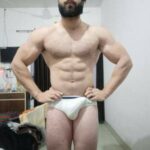 Muscular horny hunk teasing his sexy nude body in pics