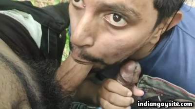 Outdoor gay threesome with a slutty cock sucker boy