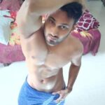 Naked muscular man teasing his big uncut desi cock