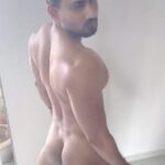 Muscular hunky man teasing his round ass in pics