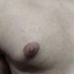 Sexy naked guy teasing nipples and ass in gay porn pics